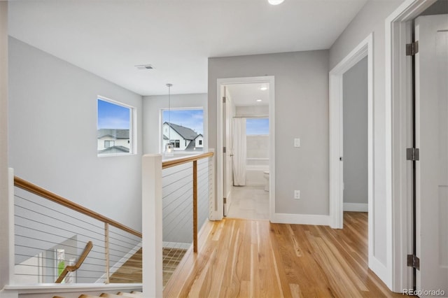 hallway with light wood-type flooring