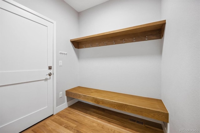 mudroom with light hardwood / wood-style floors