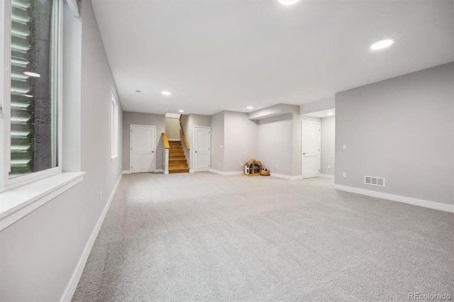 basement featuring carpet flooring