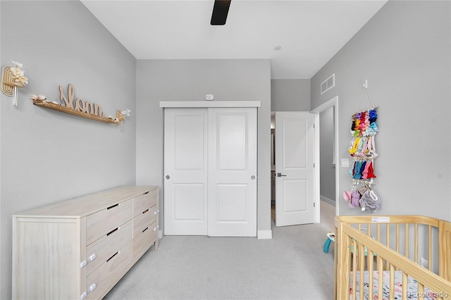 6211 W 28th Ct, Wheat Ridge, CO 80214 - bedroom with light carpet, a closet, and a ceiling fan