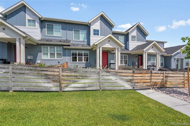 6211 W 28th Ct, Wheat Ridge, CO 80214 - multi unit property with board and batten siding and a fenced front yard