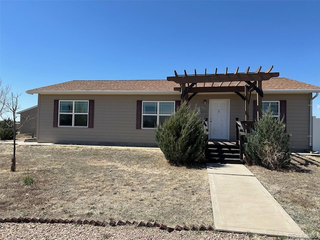 ranch-style home featuring a pergola