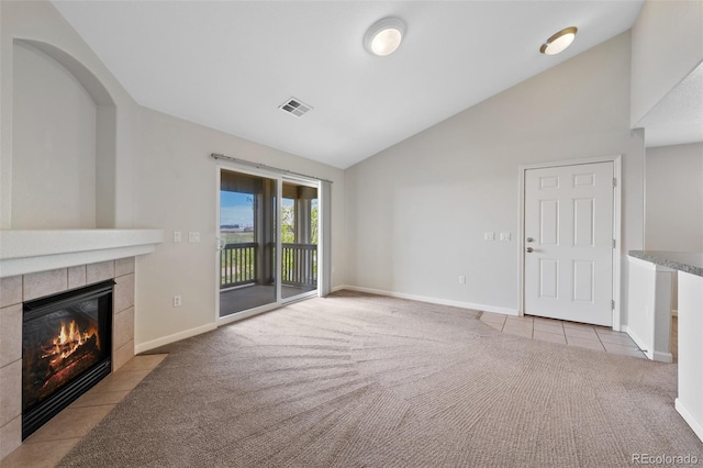 23451 E 5th Dr Unit 203, Aurora, CO 80018 - unfurnished living room featuring carpet, lofted ceiling, a fireplace, and baseboards