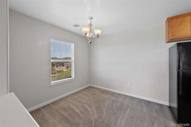 23451 E 5th Dr Unit 203, Aurora, CO 80018 - unfurnished dining area featuring a chandelier, carpet, and baseboards