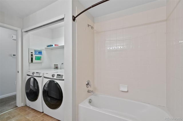 23451 E 5th Dr Unit 203, Aurora, CO 80018 - washroom featuring washing machine and clothes dryer and baseboards