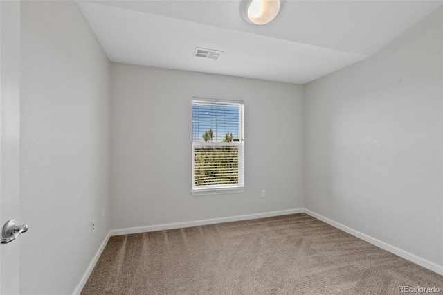 23451 E 5th Dr Unit 203, Aurora, CO 80018 - carpeted spare room featuring baseboards