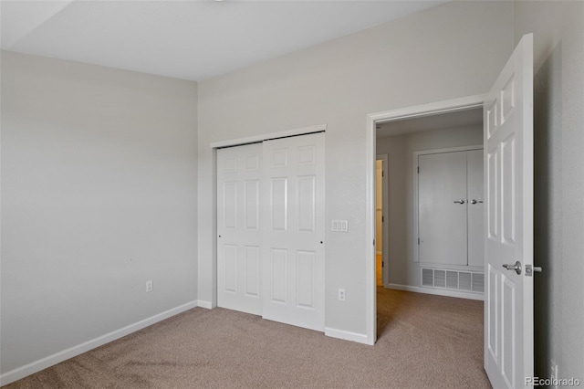 23451 E 5th Dr Unit 203, Aurora, CO 80018 - unfurnished bedroom with carpet floors, baseboards, and a closet