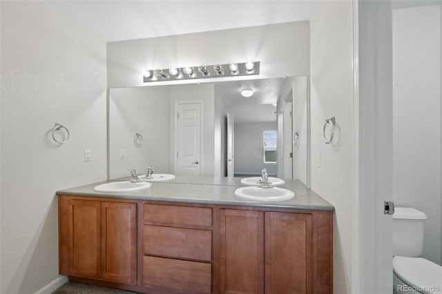 23451 E 5th Dr Unit 203, Aurora, CO 80018 - bathroom with toilet and double vanity