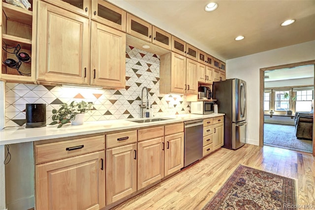 587 21 1/8 Rd, Grand Junction, CO 81507 - kitchen with a sink, light brown cabinets, light wood-style flooring, stainless steel appliances, and recessed lighting