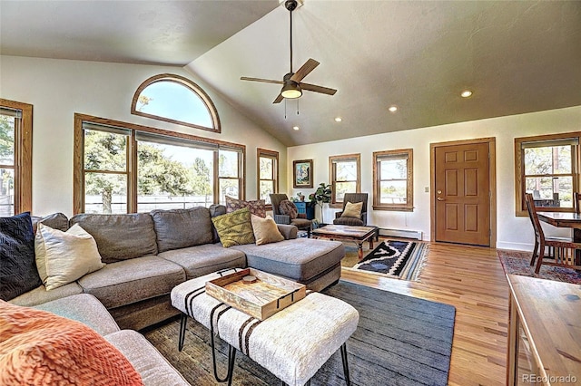 587 21 1/8 Rd, Grand Junction, CO 81507 - living room with a healthy amount of sunlight, high vaulted ceiling, ceiling fan, and light wood-type flooring