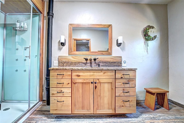 587 21 1/8 Rd, Grand Junction, CO 81507 - bathroom with vanity, wood finished floors, and a shower stall