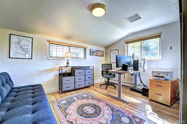 587 21 1/8 Rd, Grand Junction, CO 81507 - office with visible vents, wood finished floors, baseboards, baseboard heating, and vaulted ceiling