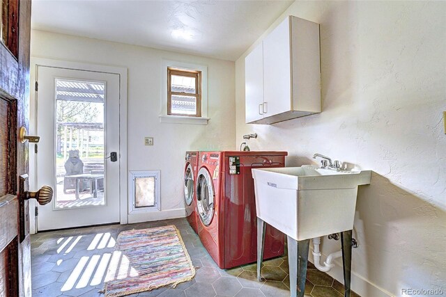 587 21 1/8 Rd, Grand Junction, CO 81507 - laundry room featuring cabinet space, independent washer and dryer, tile patterned floors, and a textured wall