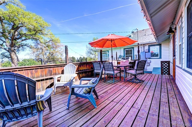 587 21 1/8 Rd, Grand Junction, CO 81507 - wooden deck featuring outdoor dining area