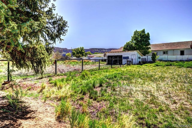 587 21 1/8 Rd, Grand Junction, CO 81507 - view of yard featuring fence and an outdoor structure