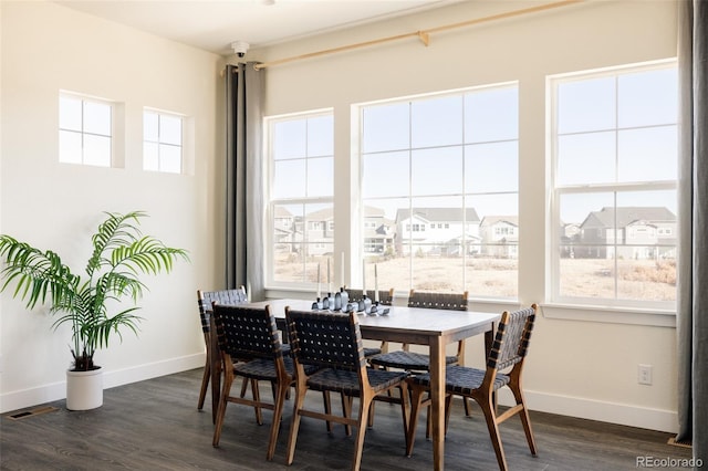 dining area featuring dark hardwood / wood-style floors