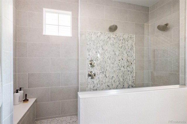 bathroom with a tile shower