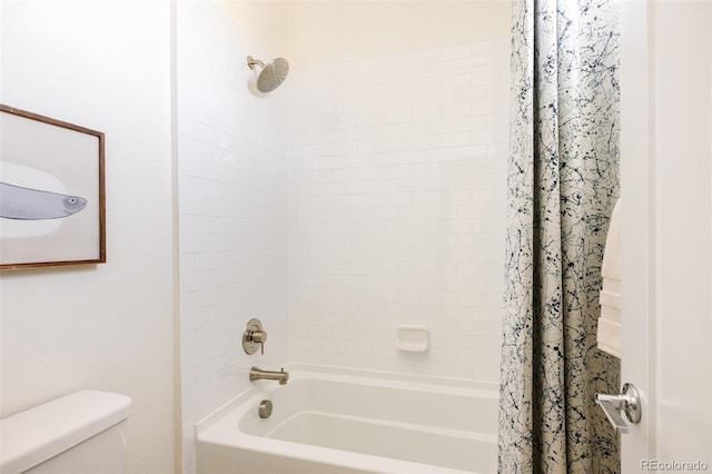 bathroom featuring shower / bath combo and toilet