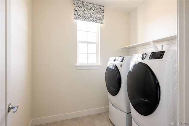 laundry area featuring independent washer and dryer and light tile patterned flooring