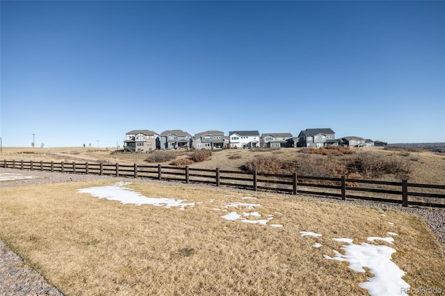 view of yard with a rural view