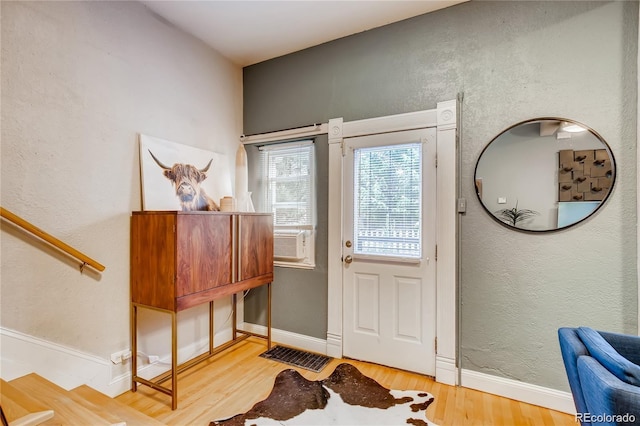 doorway with wood-type flooring