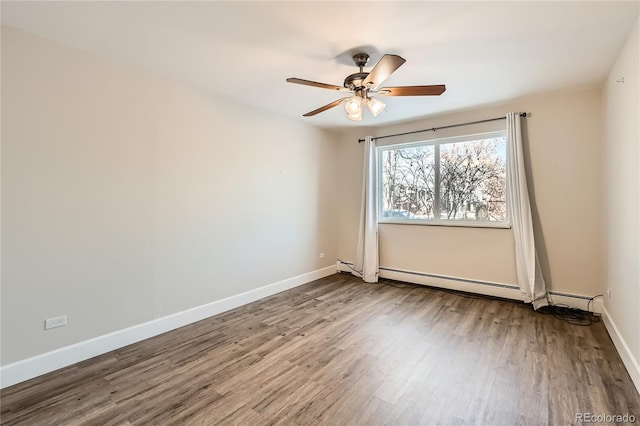 unfurnished room with a baseboard radiator, wood finished floors, a ceiling fan, and baseboards