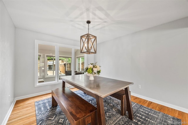 5991 S Eudora Way, Centennial, CO 80121 - dining room featuring baseboards, light wood-style flooring, and a chandelier