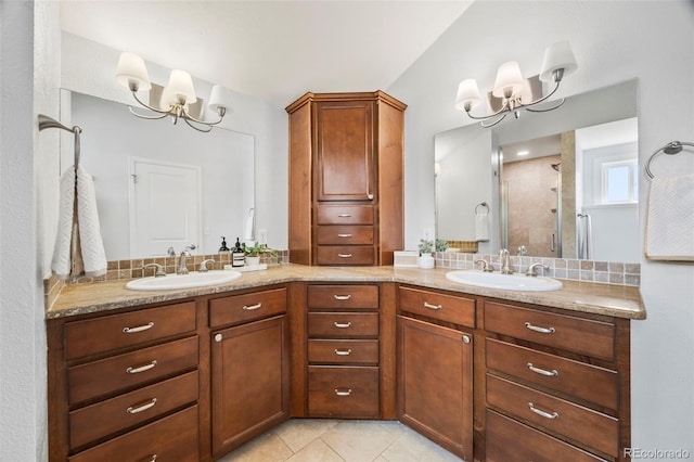 5991 S Eudora Way, Centennial, CO 80121 - full bathroom with a chandelier, double vanity, a stall shower, and tile patterned floors