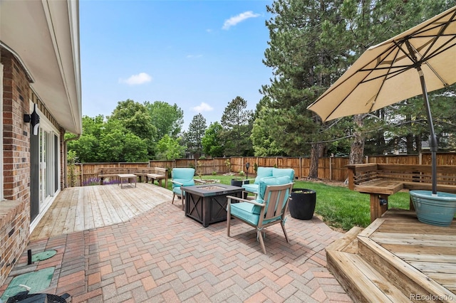 5991 S Eudora Way, Centennial, CO 80121 - fenced backyard with a fire pit, a deck, a patio, and view of wooded area