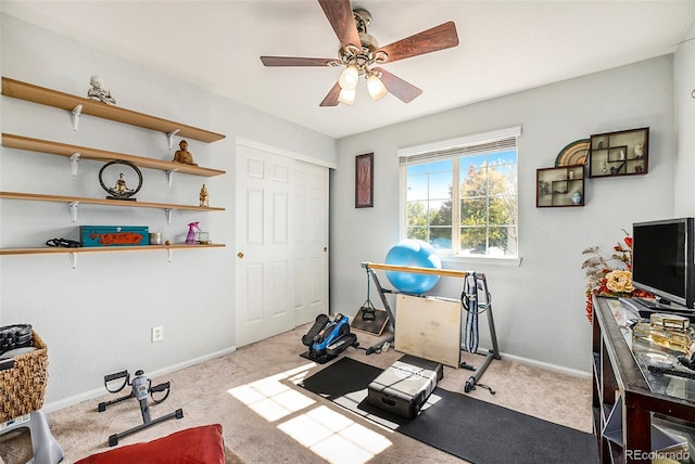 workout area with light carpet and ceiling fan