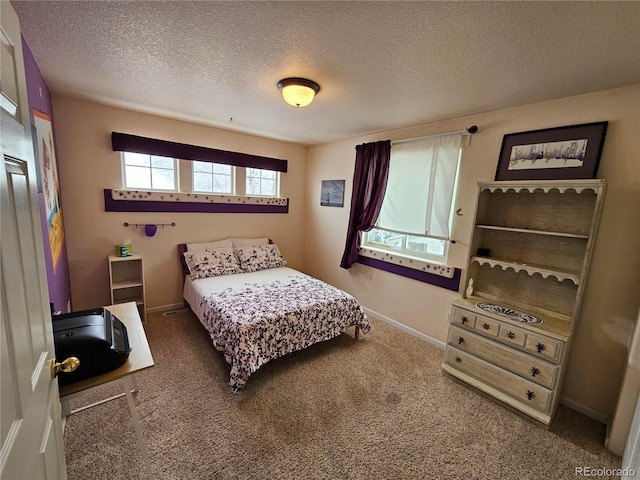 carpeted bedroom with a textured ceiling