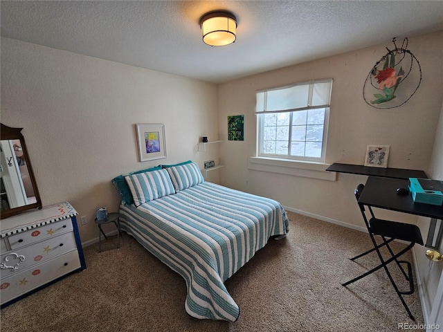 carpeted bedroom with a textured ceiling