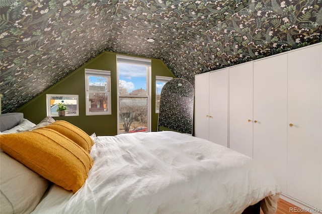 bedroom with vaulted ceiling