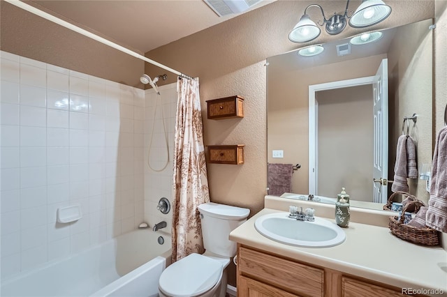 full bathroom with shower / bath combo with shower curtain, vanity, and toilet