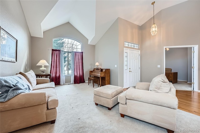 carpeted living room with vaulted ceiling