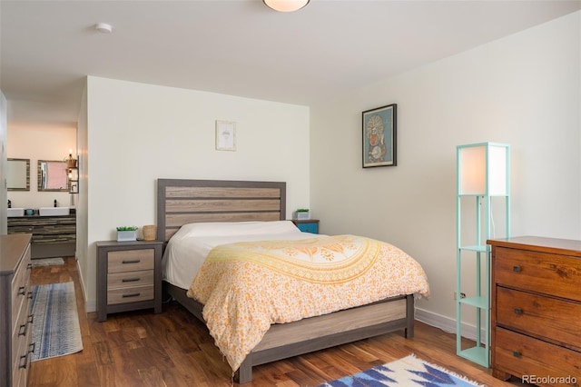 bedroom with dark hardwood / wood-style flooring