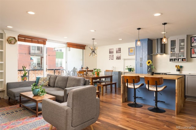 living room featuring dark hardwood / wood-style floors and ornamental molding