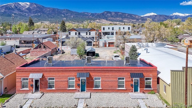 birds eye view of property featuring a mountain view