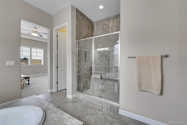 full bathroom with a stall shower, baseboards, ceiling fan, and recessed lighting