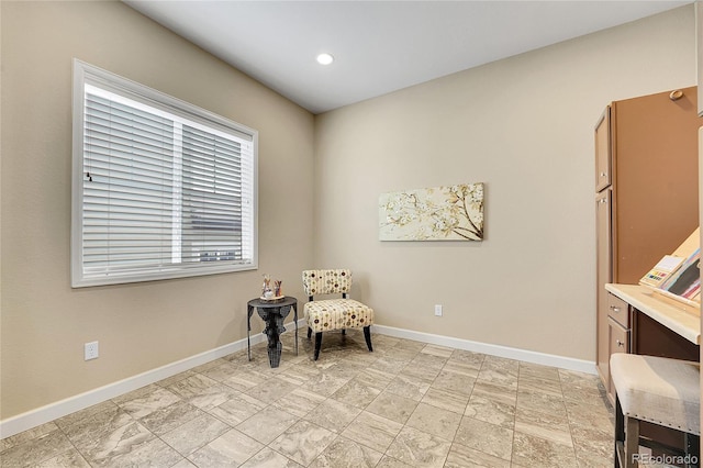 sitting room with baseboards and recessed lighting