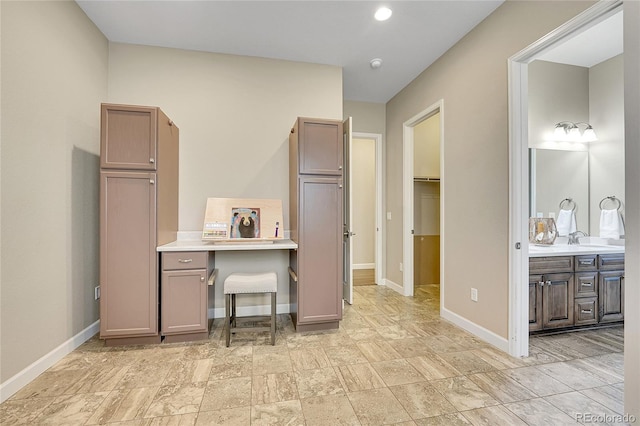 bathroom with baseboards and vanity