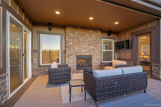 27615 E Moraine Dr, Aurora, CO 80016 - wooden deck with an outdoor living space with a fireplace