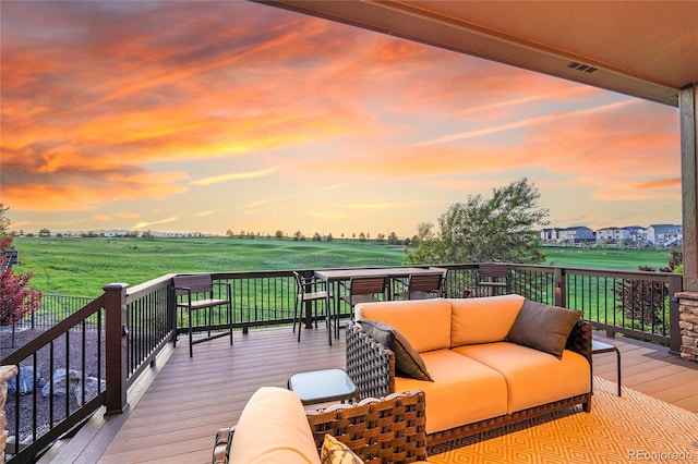 27615 E Moraine Dr, Aurora, CO 80016 - deck at dusk featuring an outdoor hangout area