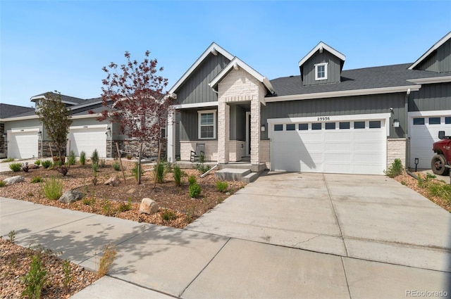 23936 E River Front Dr, Aurora, CO 80019 - craftsman inspired home with an attached garage, board and batten siding, concrete driveway, and stone siding