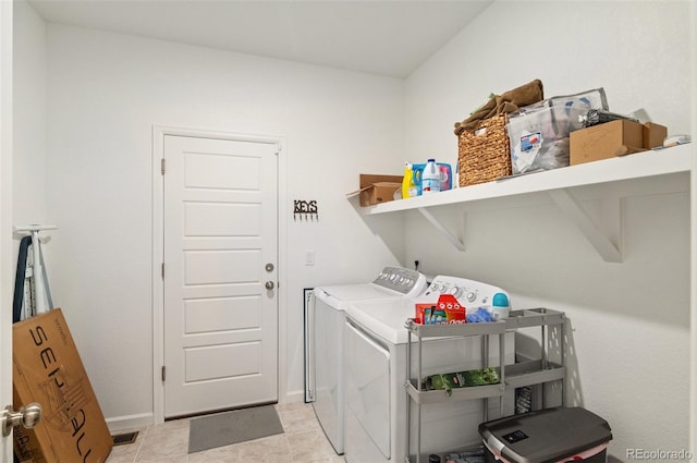 23936 E River Front Dr, Aurora, CO 80019 - washroom featuring washer and clothes dryer and baseboards