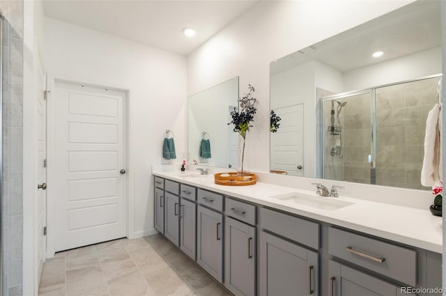 23936 E River Front Dr, Aurora, CO 80019 - bathroom with double vanity, a shower stall, and marble look tiles