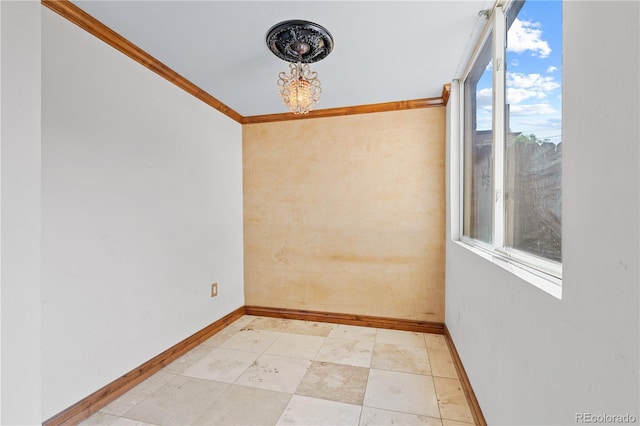 1196 N Grant St Unit 106, Denver, CO 80203 - spare room featuring ornamental molding and a chandelier