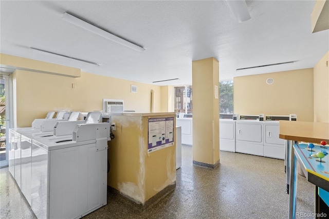 1196 N Grant St Unit 106, Denver, CO 80203 - community laundry room featuring washing machine and dryer and plenty of natural light