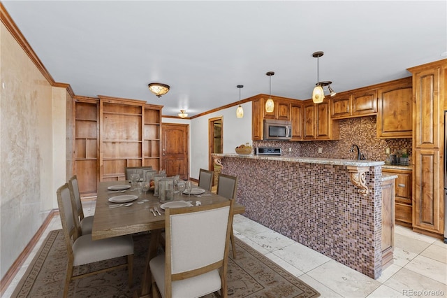 1196 N Grant St Unit 106, Denver, CO 80203 - dining space featuring crown molding