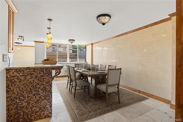 1196 N Grant St Unit 106, Denver, CO 80203 - dining space featuring ornamental molding and light tile patterned floors